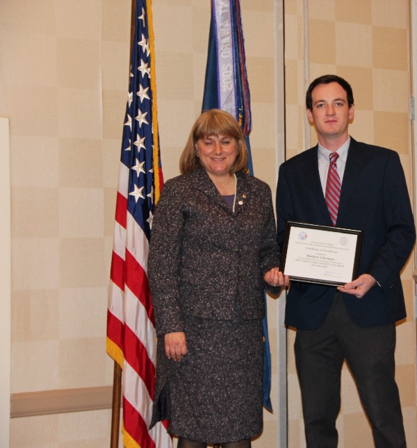 Duvall presents the January Civilian Cyber Professional Award to Matt Liberman of the Old Dominion University Student Chapter.